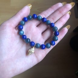 Gem bracelet. I added the shell charm from my old necklace to give it a nice touch.