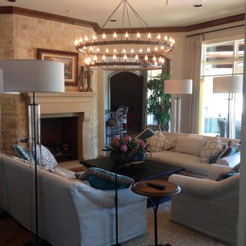 Protech Electric - a living room with a fireplace and chandelier - Electricians Near Me - Edmond, Oklahoma Protech Electric - a living room with a fireplace and chandelier - Electricians Near Me - Edmond, Oklahoma