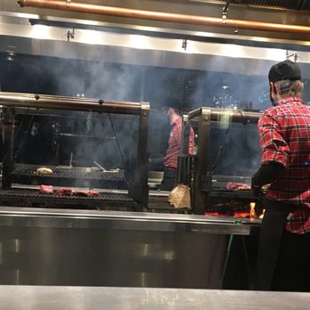 Bigfire - Watching the steaks cooking. - American Near Me - Orlando, Florida Bigfire - Watching the steaks cooking. - American Near Me - Orlando, Florida
