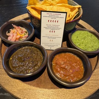 La Popular - Salsa Flight - Four Salsas from Mild to Hot going clockwise from the Avocado Salsa Verde - Mexican Near Me - Porter Ranch, California La Popular - Salsa Flight - Four Salsas from Mild to Hot going clockwise from the Avocado Salsa Verde - Mexican Near Me - Porter Ranch, California