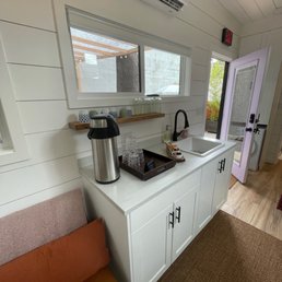 Another view of the inside of separate outer room in backyard. AC with blinds on windows for privacy.