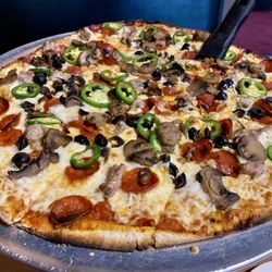 The Pizza Pub - Build your own with ingredients offered. Jalepeno, black olive, mushroom, italian sausage & pepperoni.