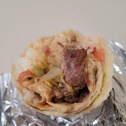 Cuban Kitchen - Lechon burrito inside (pico de gallo, ghbbq and cienfuegos sauce, no beans)