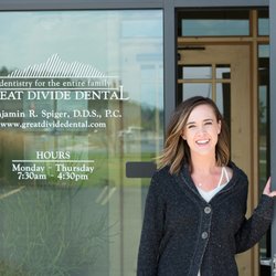 Great Divide Dental - Smiling patient at the front entrance of Great Divide Dental, family dentist in Helena MT