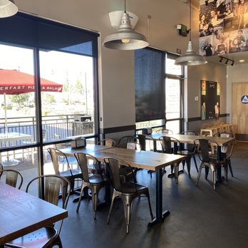 MOD Pizza - Seating area, high and dining tables available - Pizza Near Me - Brentwood, California MOD Pizza - Seating area, high and dining tables available - Pizza Near Me - Brentwood, California