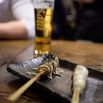 Zakkushi on Queen West - a glass of beer in the background - Japanese Near Me - Toronto, Ontario Zakkushi on Queen West - a glass of beer in the background - Japanese Near Me - Toronto, Ontario