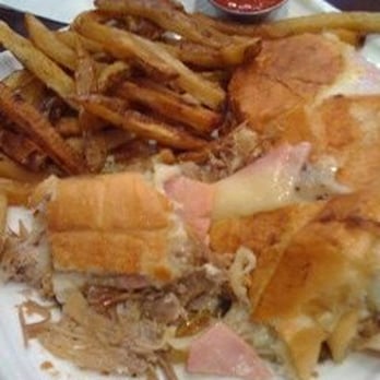 Blend - cuban sandwich with fries. bread cut unevenly so it was a messy, use a knife & fork situation. - Latin American Near Me - Long Island City, New York