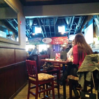 Toad 'n' Turtle - woman sitting at a table in a restaurant - Pubs Near Me - Red Deer, Alberta Toad 'n' Turtle - woman sitting at a table in a restaurant - Pubs Near Me - Red Deer, Alberta