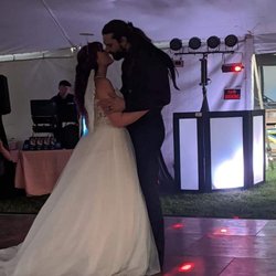 All World Entertainment DJ Service - Bride and groom's first dance with the DJ booth in the background.