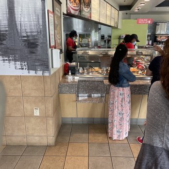 Panda Express - Worker half mask and on phone - Chinese Near Me - Lees Summit, Missouri