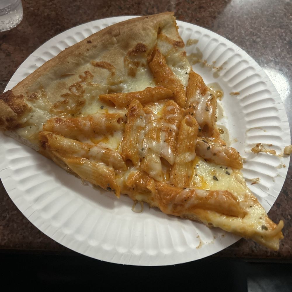 Slice of vodka pasta pizza