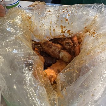 Angry Crab Shack - The boil for 2: king crab, 2 lobster tails, snow crab, headless shrimp, corn, sausage, potatoes & added half a pound of clams - Seafood Near Me - Everett, Washington