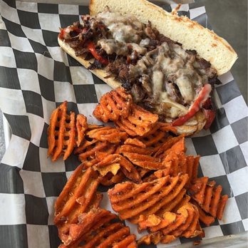 Cabana Blue - Philly steak cheese sandwich with sweet potato fries - Sports Bars Near Me - Clay Township, Michigan