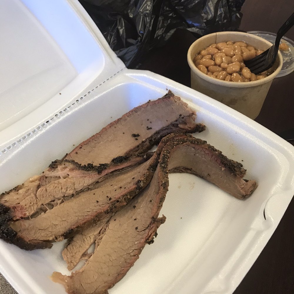 Three slices of brisket and some beans Three slices of brisket and some beans