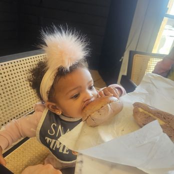 Abe's Bagel House - My daughter is enjoying her huge Blueberry Bagel! - Bagels Near Me - Rockaway, New Jersey Abe's Bagel House - My daughter is enjoying her huge Blueberry Bagel! - Bagels Near Me - Rockaway, New Jersey
