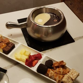The Melting Pot - Yin and yang chocolate fondue with assorted desserts for dipping - Fondue Near Me - Red Bank, New Jersey The Melting Pot - Yin and yang chocolate fondue with assorted desserts for dipping - Fondue Near Me - Red Bank, New Jersey