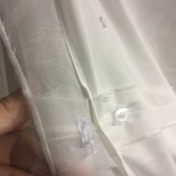David's Bridal - And messy loops like this all the way round the end of the skirt to attach to each button