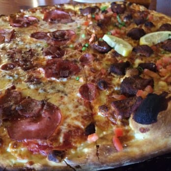 Moose's Tooth - Half carnivore and half blackened salmon thin crust pizza - Pizza Near Me - Anchorage, Alaska Moose's Tooth - Half carnivore and half blackened salmon thin crust pizza - Pizza Near Me - Anchorage, Alaska