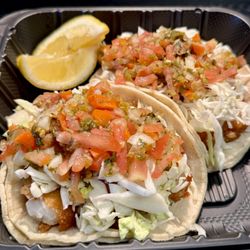 Delicious Fish Tacos w/tartar sauce, cabbage, salsa mexicana