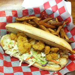 Judice's Cajun Cafe - Shrimp po'boy served with seasoned fries. We ate a few of the shrimp before I took this picture!