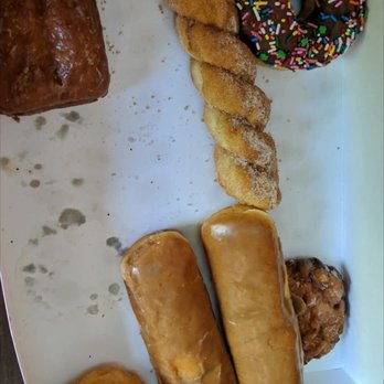 Fluffy Donut Cafe & Bagels - Partially eaten dozen donuts. - Donuts Near Me - Bellevue, Washington Fluffy Donut Cafe & Bagels - Partially eaten dozen donuts. - Donuts Near Me - Bellevue, Washington