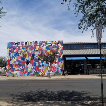 Zinburger - South side of Zinburger with a cool mural painted on the wall by @sleisure. - Burgers Near Me - Gilbert, Arizona Zinburger - South side of Zinburger with a cool mural painted on the wall by @sleisure. - Burgers Near Me - Gilbert, Arizona