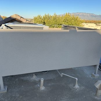 Extra Mile Builders - Fabricated and installed welded steel AC unit cover with stucco finish - General Contractors Near Me