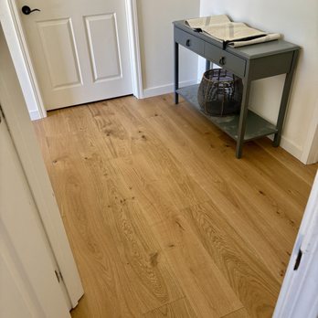 Lam's Flooring - Nasty carpet removed on second floor staircase landing, beautiful 4mm engineered wood installed. - Flooring Near Me