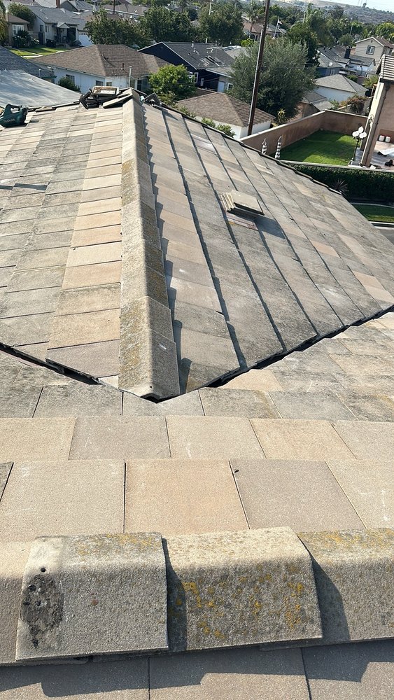 Slide of T’s Roofing 