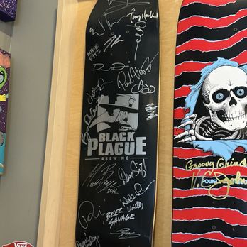 Grinderz - Black plague tribute board with tons of signatures on it, including Tony Hawk - Burgers Near Me - Huntington Beach, California Grinderz - Black plague tribute board with tons of signatures on it, including Tony Hawk - Burgers Near Me - Huntington Beach, California