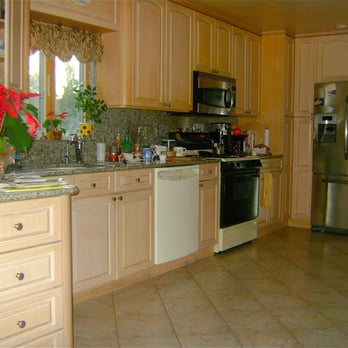 Pat's Construction - a kitchen with a refrigerator, dishwasher, and dishwasher - General Contractors Near Me
