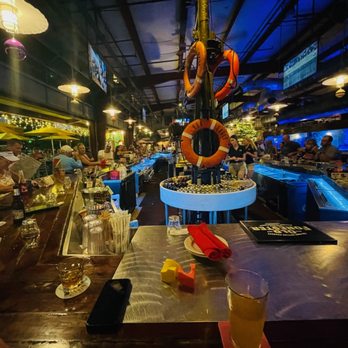 Conch Republic Seafood - Grab a happy hour seat at the enormous bar and enjoy bonus entertainment courtesy of the locals. - Seafood Near Me - Key West, Florida