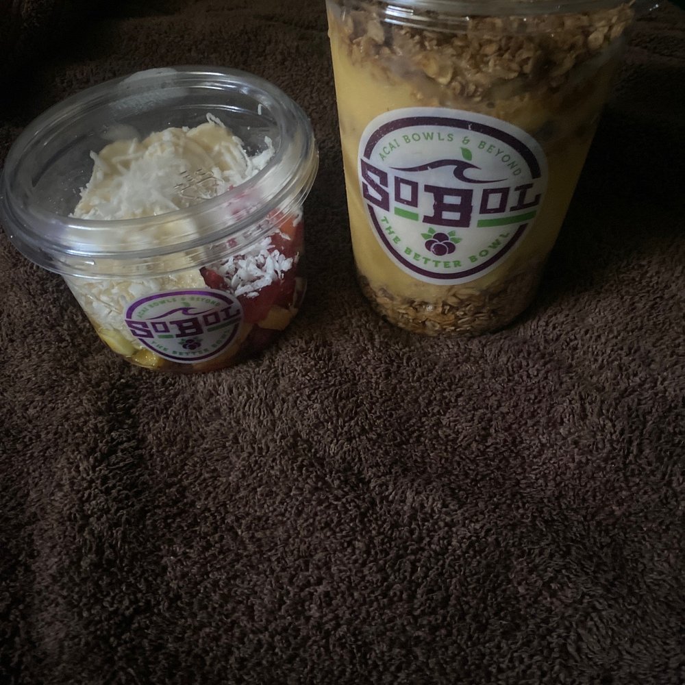 Mango pineapple with extra strawberries, extra bananas, and extra granola