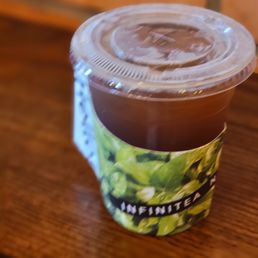 a cup of iced coffee on a table