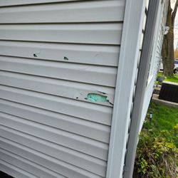 AJ's Pressure Cleaning and Seal Coating - Hole blasted through siding-not returning to fix as promissed
