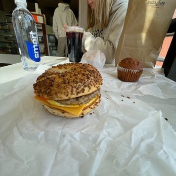 What A Bagel - My sandwich which was ok, cute girl and rock solid muffin in the background - Bagels Near Me - Nashua, New Hampshire
