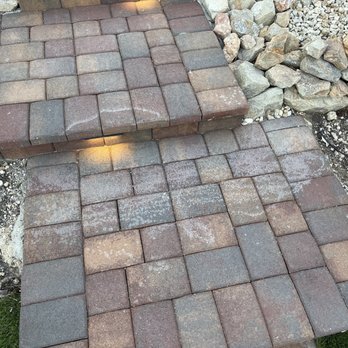 MBA Landscaping Service - White stain left by the workers after "fixing" the pavers. - Landscaping Near Me