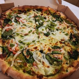 Veggie pizza with pesto added Veggie pizza with pesto added