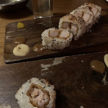 Uchi Austin - Look at the pork belly difference. Hard to tell in the picture it the closer roll is half the size - Sushi Bars Near Me - Austin, Texas Uchi Austin - Look at the pork belly difference. Hard to tell in the picture it the closer roll is half the size - Sushi Bars Near Me - Austin, Texas