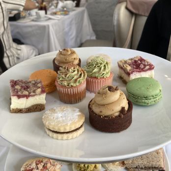 Courtyard Tea Room - Sweet tier - strawberry matcha cupcake, alfajores, french macaron, raspberry cheesecake, chocolate peanut butter tart - Tea Rooms Near Me - Boston, Massachusetts