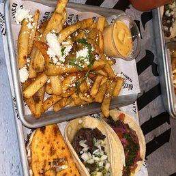 Mexican street fries, carne asada taco, chimmichuri taco, birria taco