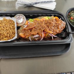 Chef Ngee Kitchen - Tilapia with jollof rice and spinach.
