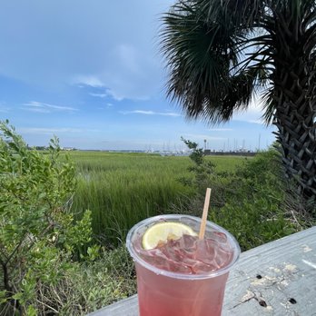Salty Mike's Deck Bar - a red drink with a slice of lemon - Dive Bars Near Me - Charleston, South Carolina Salty Mike's Deck Bar - a red drink with a slice of lemon - Dive Bars Near Me - Charleston, South Carolina