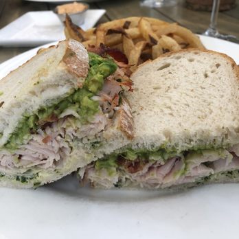 Tiny Boxwoods - Turkey and Avocado Club Sandwich with regular french fries. incredible! spotted: mimosa and Mothers Breakfast - also delish! - New American Near Me - Houston, Texas