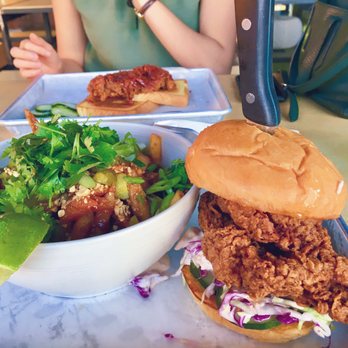 Basilisk - Dandan fries, left, $8. Fried chicken sandwich, right, $8. Dope dope dope. - New American Near Me - Portland, Oregon