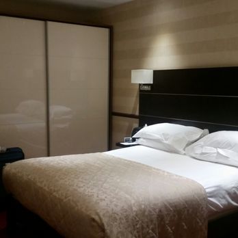 Hollies Hotel - Comfortable spacious sleeping area,  separate from sitting area. - Hotels Near Me