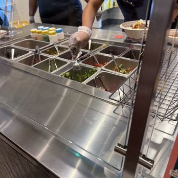 CAVA - toppings station - Mediterranean Near Me - Evans, Georgia