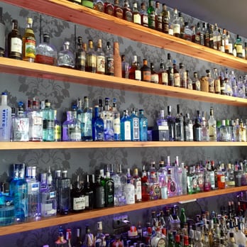 La Gintoneria - The well-stocked wall of spirits at La Gintoneria. Notice the abundant variety of gins. - Cocktail Bars Near Me - Donostia / San Sebastián, SS La Gintoneria - The well-stocked wall of spirits at La Gintoneria. Notice the abundant variety of gins. - Cocktail Bars Near Me - Donostia / San Sebastián, SS