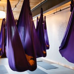 Common Ground Yoga - Savasana gets an upgrade with the supporting and nurturing aerial hammock.