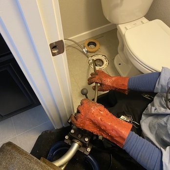 Aspen View Homes - a man fixing a toilet - General Contractors Near Me - Colorado Springs, Colorado
